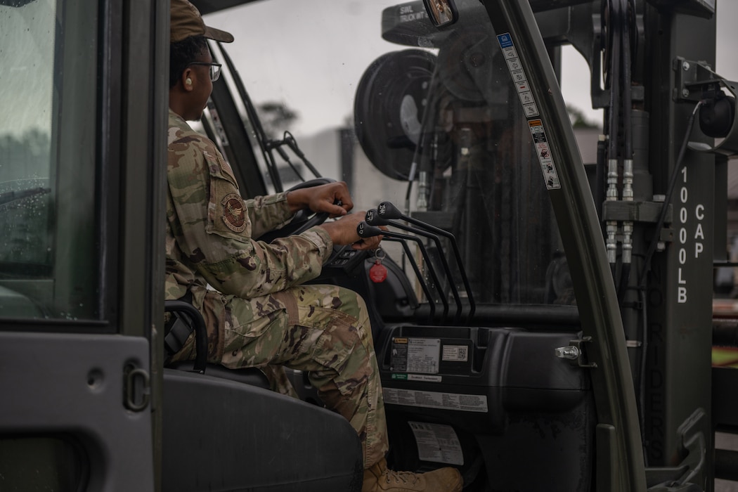 A Airman operates the forklift.