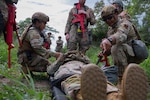 U.S. Air Force Staff. Sgt. Chastilynn Tittle, an emergency management specialist with the 154 Civil Engineer Squadron, Hawaii Air National Guard, left, and Staff Sgt. Ashviel Cruz Aponte, an emergency management specialist with the 156th Civil Engineer Squadron, Puerto RicoAir National Guard, strap an airman on a stretcher during the 2025 Virgin Islands and Puerto Rico emergency management Deployment for Training at Fort Allen, Juana Diaz, Puerto Rico, May 18, 2025. The 2025 VIPR EM DFT measured multiple ANG civil engineer squadrons’ mission readiness by simulating an austere location to prepare participating Airmen to execute the Agile Combat Employment Concept within the U.S. Air Force Indo-Pacific Command area of responsibility. (U.S. Air National Guard photo by 1st Lt. Eliezer Soto)