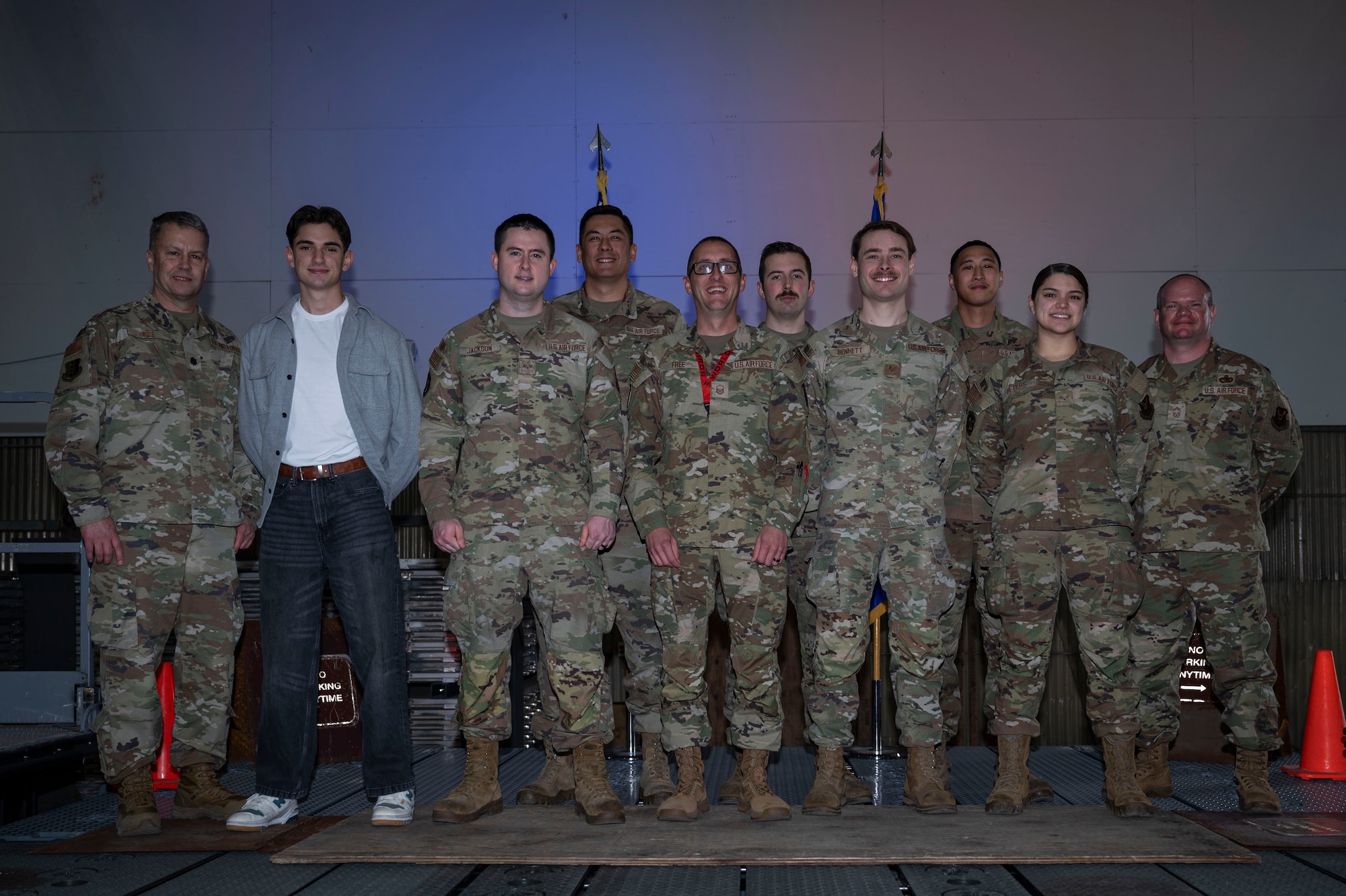 Lt. Col. Wilburn Poe, 28th Maintenance Group deputy commander and Chief Master Sgt. Daniel Werner, 37th Bomber Generation Squadron senior enlisted leader, pose for a photo with 2024 Maintenance Professional of the Year awards recipients at Grand Forks Air Force Base, N.D., April 25, 2025.