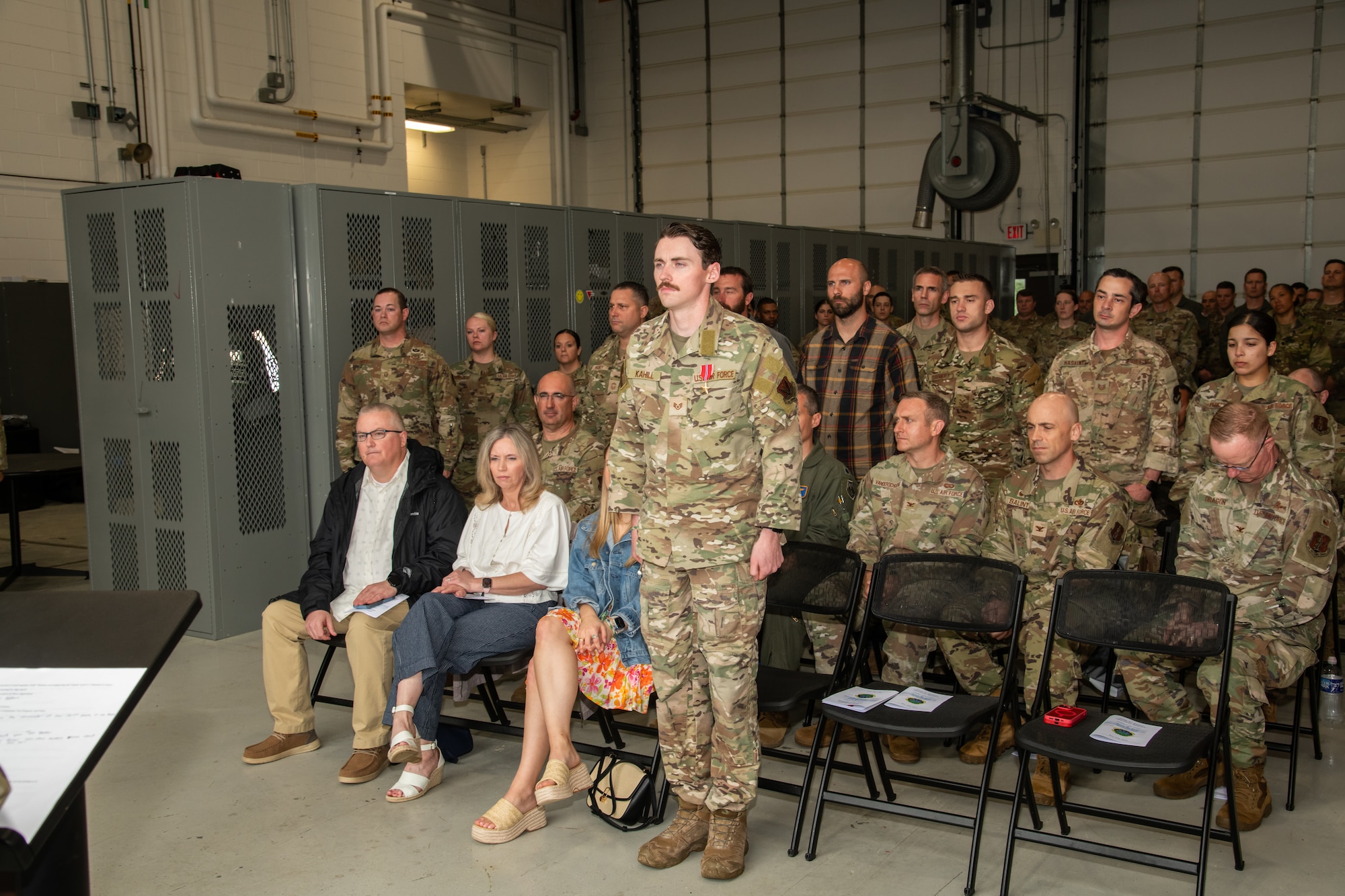U.S. Air Force Staff Sgt. Justin Kahill, 227th Joint Terminal Attack Controller, center, stands with his fellow members of the 227th Air Support Operations Squadron during a Bronze Star Medal and Casing of the Colors Ceremony at the 177th Fighter Wing, Egg Harbor Township, New Jersey, May 4, 2025. The Bronze Star is awarded to service members who distinguish themselves by heroic or meritorious achievement or service in a combat zone. The Casing of the Colors Ceremony marks a transition of a unit, whether that be inactivation, relocation, or deployment.
