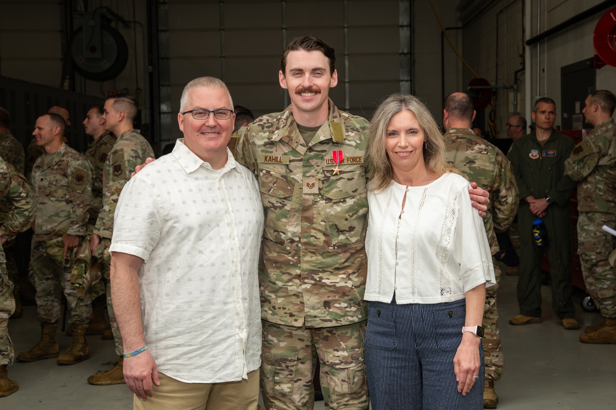 U.S. Air Force Staff Sgt. Justin Kahill, 227th Joint Terminal Attack Controller, poses for a picture with his family at the 177th Fighter Wing, Egg Harbor Township, New Jersey, May 4, 2025. Kahill was awarded the Bronze Star Medal for his meritorious service in a combat zone from March 2024 to Nov. 2024.