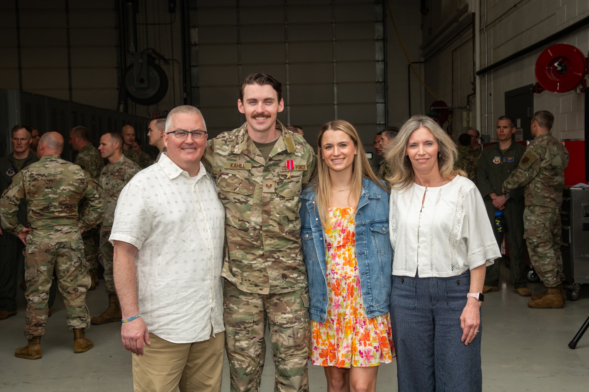 U.S. Air Force Staff Sgt. Justin Kahill, 227th Joint Terminal Attack Controller, poses for a picture with his family at the 177th Fighter Wing, Egg Harbor Township, New Jersey, May 4, 2025. Kahill was awarded the Bronze Star Medal for his meritorious service in a combat zone from March 2024 to Nov. 2024.