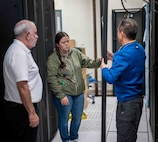 Penguin Computing personnel on site during HPC server installation May 9, 2025. As part of a first-of-its-kind lease agreement, Kelsey N. Beall (center), an engineer from Penguin, will work full-time alongside Carderock SeaTech engineers to provide routine updates, troubleshooting, and system support.