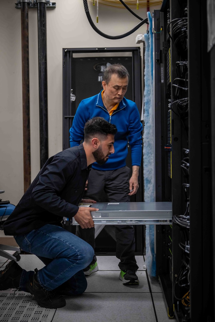 NSWC Carderock, West Bethesda, Md. | May 9, 2025 Personnel from Penguin Computing install new High-Performance Computing server clusters into a lower server rack in Carderock's Ship Engineering and Analysis Technology Center (SEATech). The upgrades are part of a first-of-its-kind lease agreement for Carderock, ensuring faster computation times, greater efficiency, and fewer obstacles for technical teams tackling critical naval research programs.