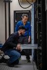 NSWC Carderock, West Bethesda, Md. | May 9, 2025 Personnel from Penguin Computing install new High-Performance Computing server clusters into a lower server rack in Carderock's Ship Engineering and Analysis Technology Center (SEATech). The upgrades are part of a first-of-its-kind lease agreement for Carderock, ensuring faster computation times, greater efficiency, and fewer obstacles for technical teams tackling critical naval research programs.