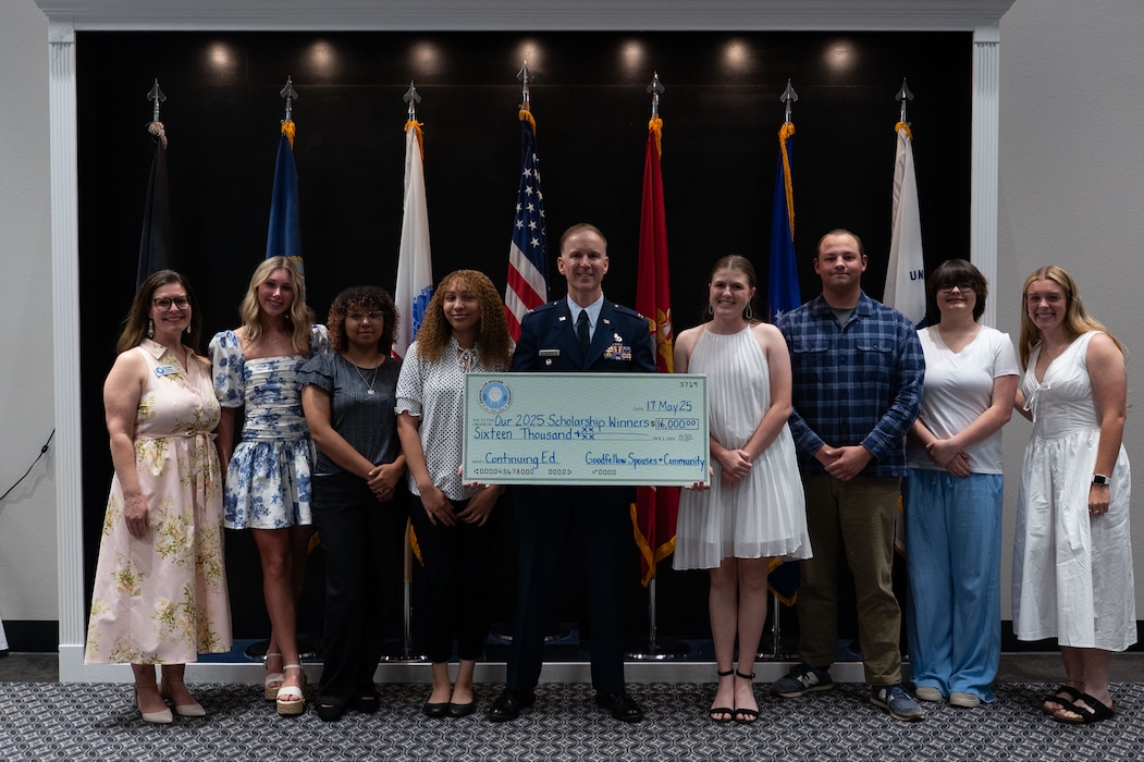 Scholarship recipients pose for a group photo with U.S. Air Force Col. Thomas “TK” Wilson, 17th Training Wing deputy commander, and Donyala Pierce, Goodfellow Spouse and Community vice president, during the 11th Annual GSC Scholarship and Awards Banquet at the Powell Event Center, Goodfellow Air Force Base, Texas, May 17, 2025. Recipients were awarded $16,000 in total from the GSC to pursue further education in their chosen fields. (U.S. Air Force photo by Airman 1st Class Brian Lummus)