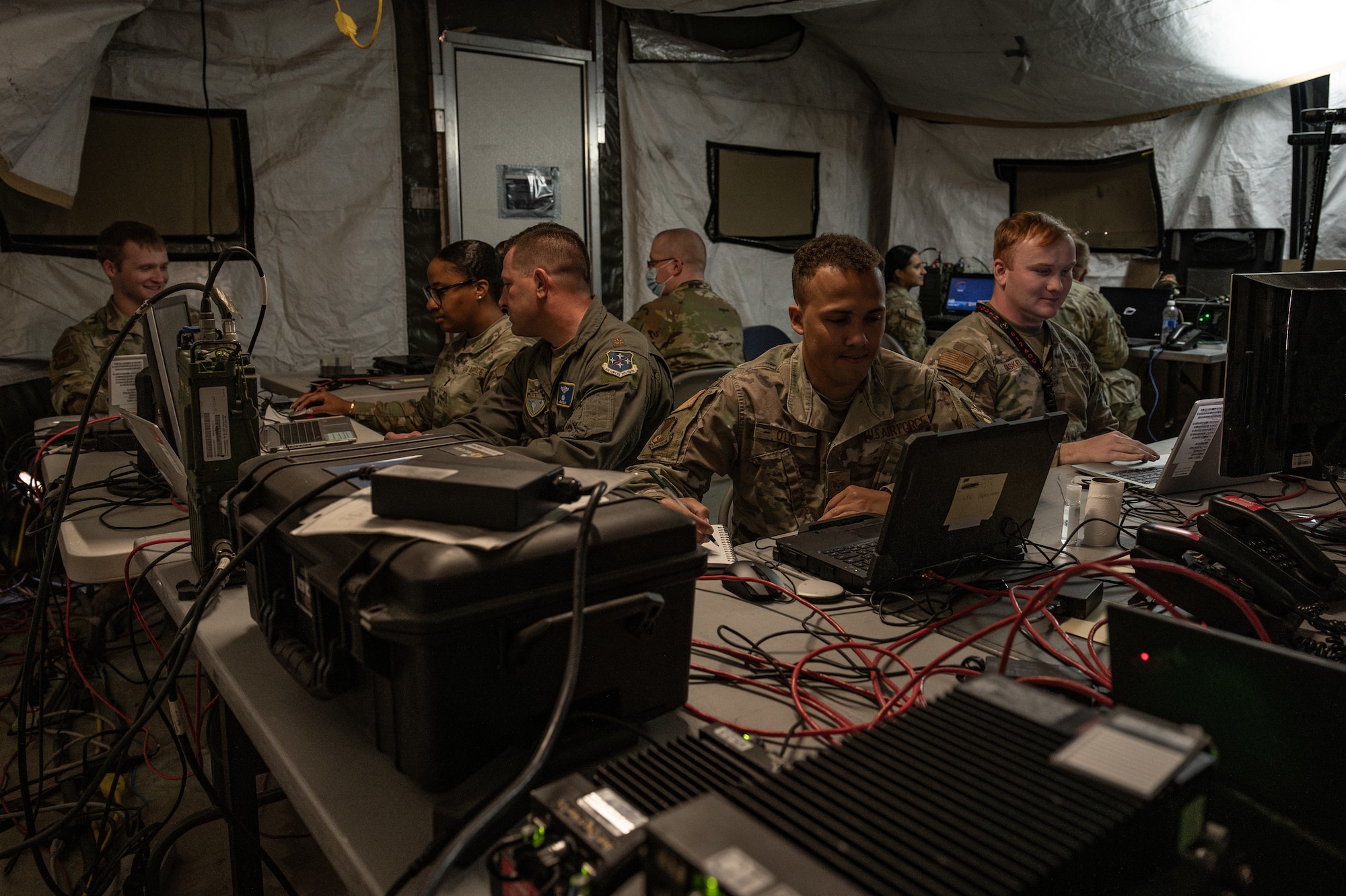 U.S. Airmen assigned to the 612th Air Operations Center (AOC) and 612th Air Communications Squadron conduct command and control operations during a mock deployment exercise at Nellis Air Force Base, Nevada, May 13, 2025. The exercise tested the unit’s ability to execute the full Air Tasking Cycle while using the Shadow Operations Center- Nellis as a simulated deployed location to produce, publish and execute the Air Tasking Order. (U.S. Air Force photo by Airman 1st Class Jennifer Nesbitt)