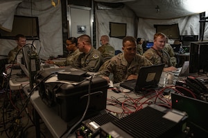 U.S. Airmen assigned to the 612th Air Operations Center (AOC) and 612th Air Communications Squadron conduct command and control operations during a mock deployment exercise at Nellis Air Force Base, Nevada, May 13, 2025. The exercise tested the unit’s ability to execute the full Air Tasking Cycle while using the Shadow Operations Center- Nellis as a simulated deployed location to produce, publish and execute the Air Tasking Order. (U.S. Air Force photo by Airman 1st Class Jennifer Nesbitt)