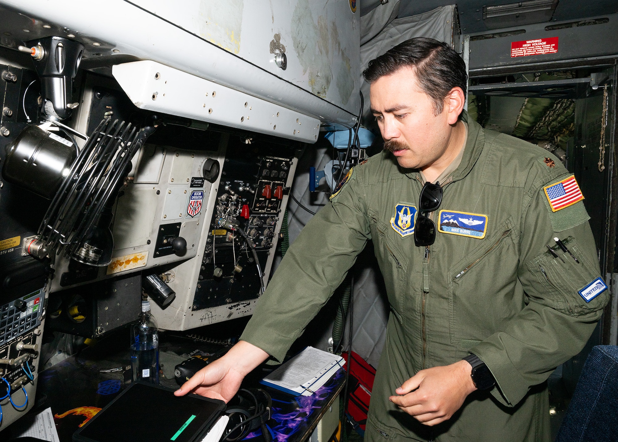 U.S. Air Force Major Michael Burns from 314th Air Refueling Squadron prepares a KC-135 before an orientation flight