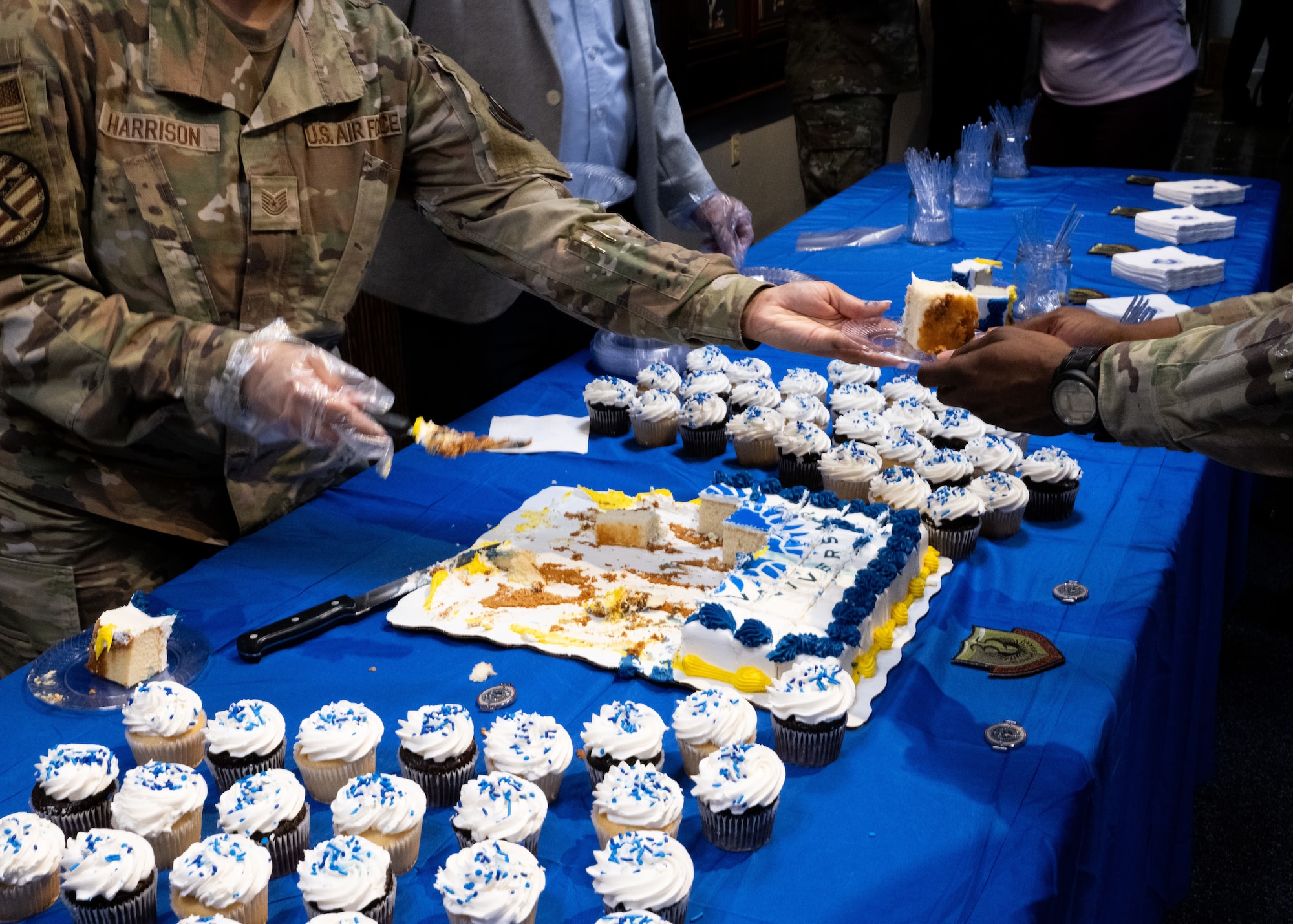 AFSOC personnel serve cake during AFSOC’s 35th Birthday cake cutting ceremony.