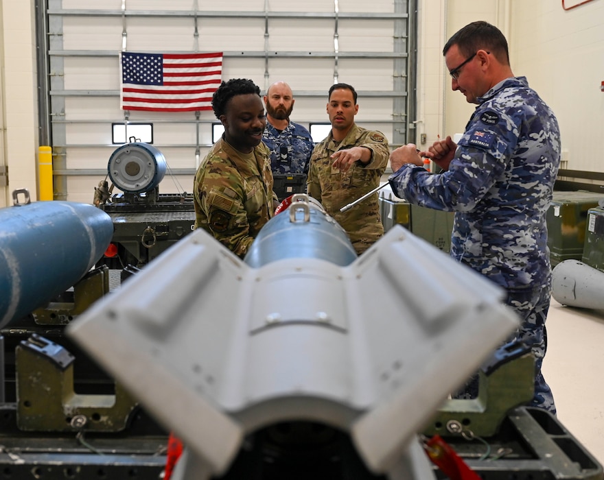 U.S. Air Force Airmen and Royal Australian Air Force Airmen assemble a GBU-12 Paveway II laser-guided dummy munition during the Combat Ammunition Production Exercise (CAPEX) at Eielson Air Force Base, Alaska, May 14, 2025.