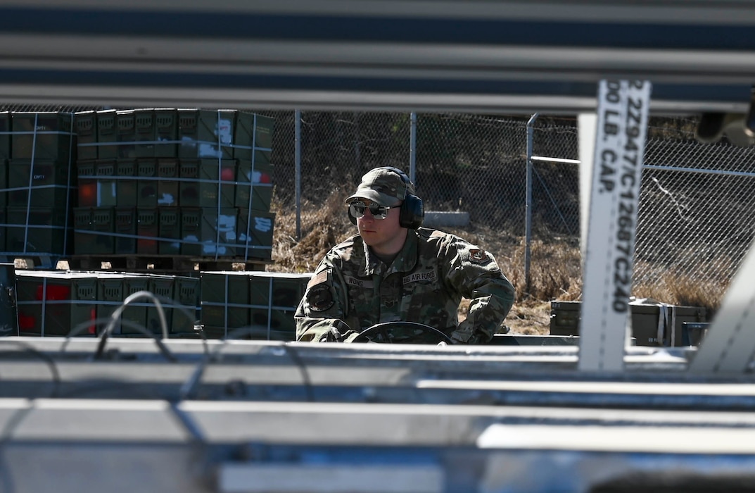 U.S. Air Force Staff Sgt. Nahele Wong, 354th Munitions Squadron conventional maintenance crew chief, operates a MJ-1 lift truck during the Combat Ammunition Production Exercise (CAPEX) at Eielson Air Force Base, Alaska, May 14, 2025.