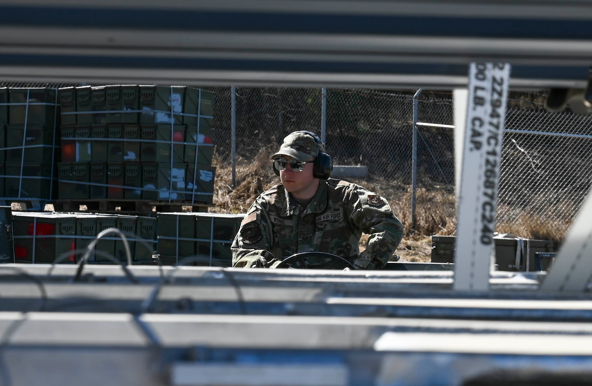 U.S. Air Force Staff Sgt. Nahele Wong, 354th Munitions Squadron conventional maintenance crew chief, operates a MJ-1 lift truck during the Combat Ammunition Production Exercise (CAPEX) at Eielson Air Force Base, Alaska, May 14, 2025.