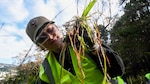 WELLINGTON, New Zealand (May 20, 2025) – Aerographer’s Mate Airman Apprentice Evelyn Steveson, assigned to 7th Fleet staff, conducts landscape beautification on Mount Victoria during a tree conservation event as part of a scheduled port visit in Wellington, New Zealand, May 20, 2025. The Blue Ridge and embarked U.S. 7th Fleet staff conduct regular Indo-Pacific patrols to deter aggression, strengthen alliances and partnerships, and advance future warfighting capabilities. (U.S. Navy photo by Mass Communication Specialist Seaman Andres Fonts)