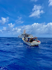 The crew of the USCGC Myrtle Hazard (WPC 1139) arrive on scene with the 47-foot motor vessel Lucky Harvest adrift around 125 nautical miles west of Guam on May 16, 2025, and set up the tow.