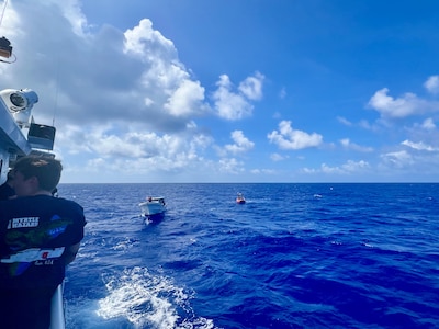 The crew of the USCGC Myrtle Hazard (WPC 1139) arrive on scene with the 47-foot motor vessel Lucky Harvest adrift around 125 nautical miles west of Guam on May 16, 2025, and begin setting up the tow.