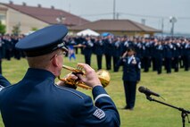 A military member plays the trumpet.