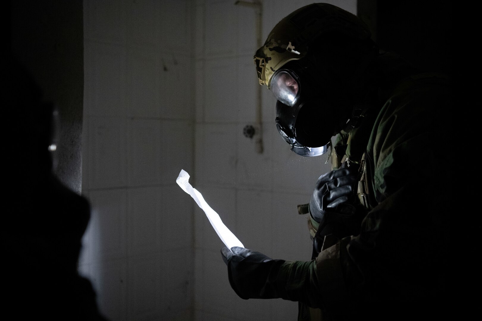 U.S. Air Force Staff Sgt. Robert Gabrielini, an emergency management specialist with the 105th Civil Engineer Squadron, New York Air National Guard, discovers a plan sheet inside a building during the 2025 Virgin Islands and Puerto Rico emergency management Deployment for Training at Fort Allen, Juana Diaz, Puerto Rico, May 18, 2025. The 2025 VIPR EM DFT measured multiple ANG civil engineer squadrons’ mission readiness by simulating an austere location to prepare participating Airmen to execute the Agile Combat Employment Concept within the U.S. Air Force Indo-Pacific Command area of responsibility. (U.S. Air National Guard photo by 1st Lt. Eliezer Soto)
