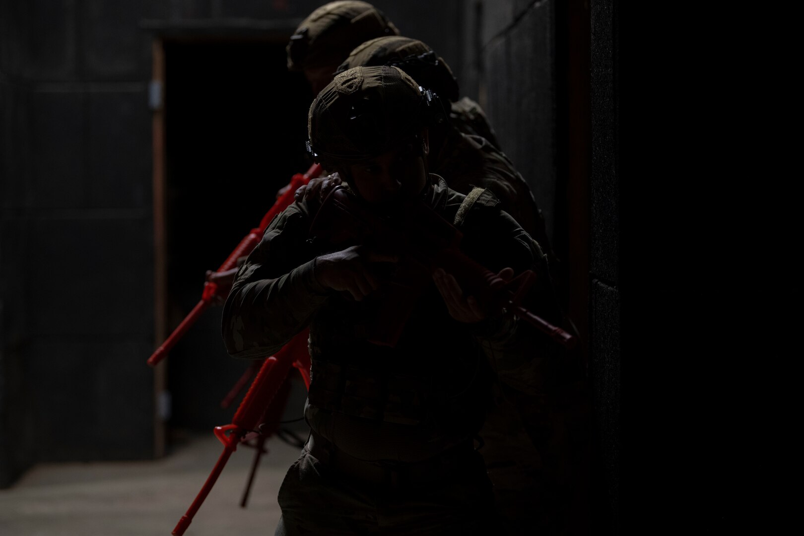 U.S. Airmen with the Air National Guard prepare to clear a room during the 2025 Virgin Islands and Puerto Rico emergency management Deployment for Training at Camp Santiago Joint Training Center, Salinas, Puerto Rico, May 15, 2025. The 2025 VIPR EM DFT measured multiple ANG civil engineer squadrons’ mission readiness by simulating an austere location to prepare participating Airmen to execute the Agile Combat Employment Concept within the U.S. Air Force Indo-Pacific Command area of responsibility. (U.S. Air National Guard photo by Senior Airman Victoria A. Jewett)