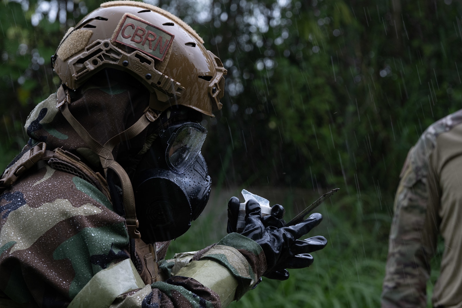 U.S. Air Force Staff. Sgt. Chastilynn Tittle, an emergency management specialist with the 154 Civil Engineer Squadron, Hawaii Air National Guard, examines a chemical explosive substance during the 2025 Virgin Islands and Puerto Rico emergency management Deployment for Training at Fort Allen, Juana Diaz, Puerto Rico, May 18, 2025. The 2025 VIPR EM DFT measured multiple ANG civil engineer squadrons’ mission readiness by simulating an austere location to prepare participating Airmen to execute the Agile Combat Employment Concept within the U.S. Air Force Indo-Pacific Command area of responsibility. (U.S. Air National Guard photo by 1st Lt. Eliezer Soto)