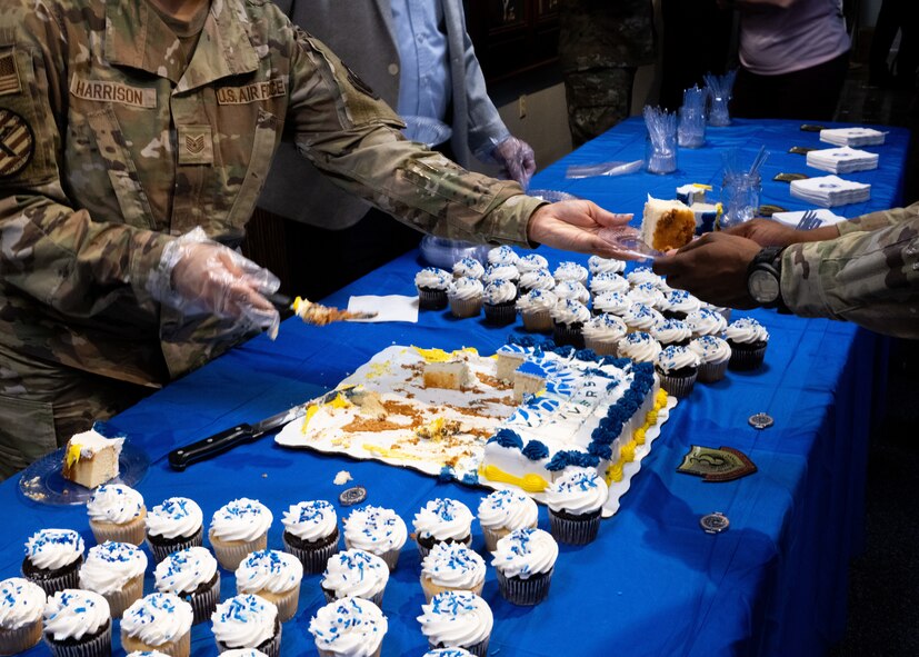 AFSOC personnel serve cake during AFSOC’s 35th Birthday cake cutting ceremony.