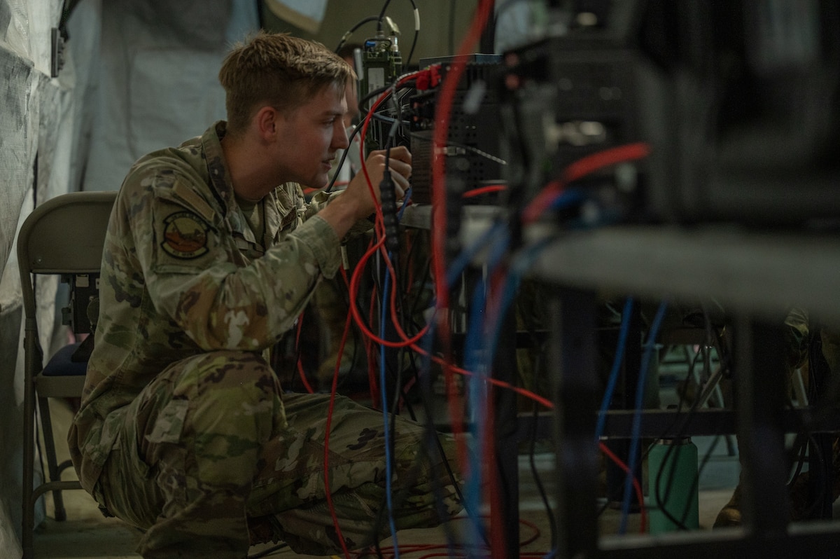 U.S. Air Force Senior Airman Michael Steers, a 612th Air Operations Center (AOC) deployable network technician, performs maintenance on command and control (C2) systems during a mock deployment to Nellis Air Force Base, Nevada, May 13, 2025. As part of the exercise, the AOC-deployable team conducted a comprehensive test to assess the operational concept for a deployed C2 capability, ensuring mission readiness anytime, anywhere.   (U.S. Air Force photo by Airman 1st Class Jennifer Nesbitt)