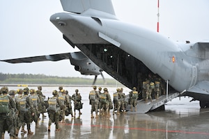 Spanish Army paratroopers board a cargo plane during an exercise
