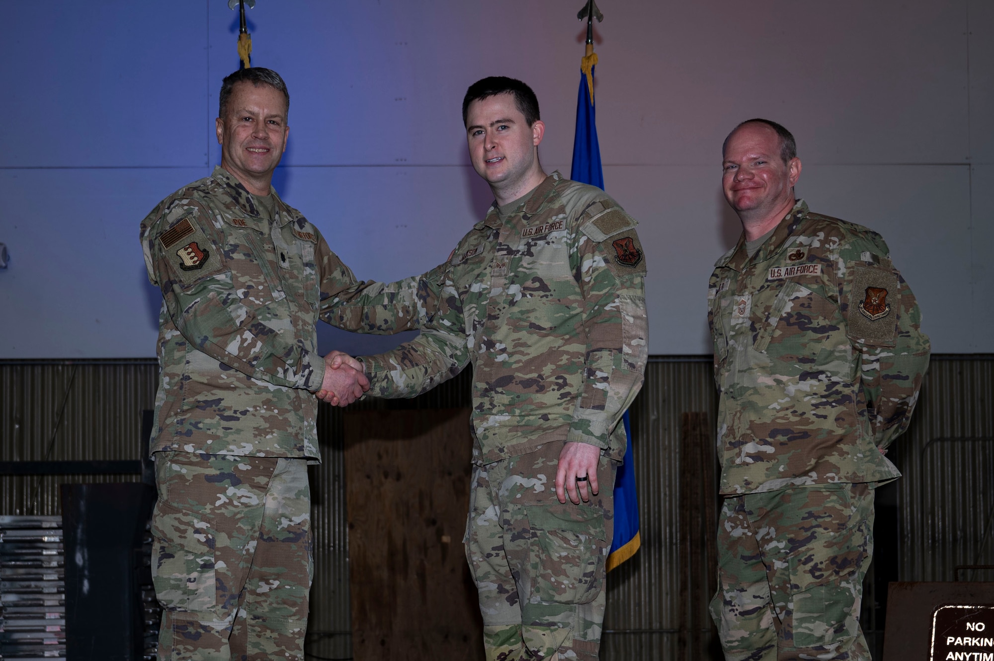 Lt. Col. Wilburn Poe, 28th Maintenance Group deputy commander and Chief Master Sgt. Daniel Werner, 37th Bomber Generation Squadron senior enlisted leader, recognize Senior Airman Stoney Jackson, 37th BGS technician, as Aircraft Avionics Technician of the Year at Grand Forks Air Force Base, N.D., April 25, 2025. There were approximately 37 awards presented during the ceremony, to acknowledge the 28th Bomb Wing airmen who went above and beyond while serving in maintenance roles 28th. (U.S. Air Force photo by Airman 1st Class Emma Funderburk)