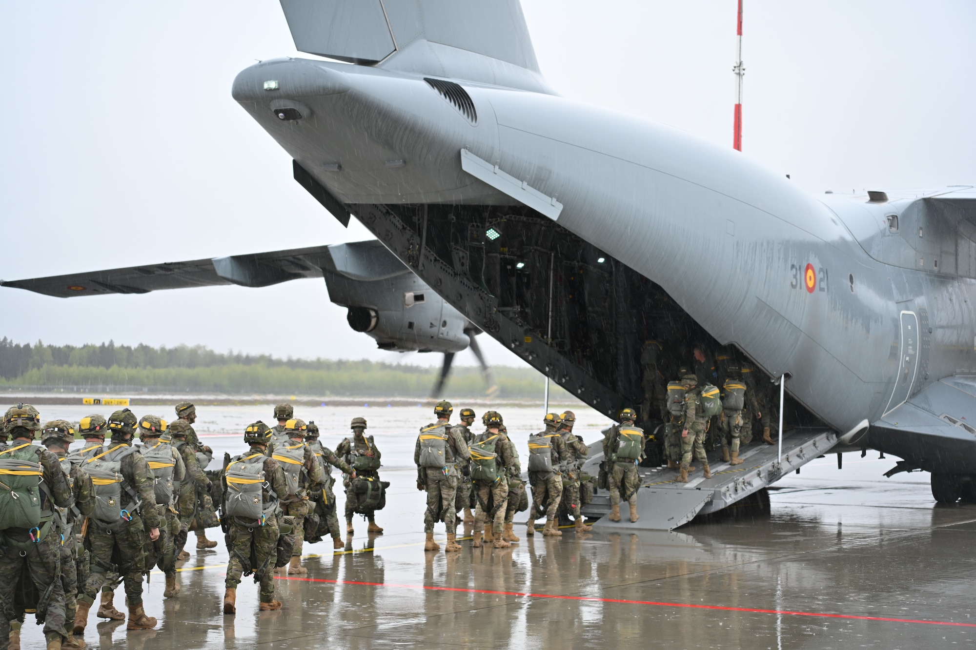 Spanish Army paratroopers board a cargo plane during an exercise