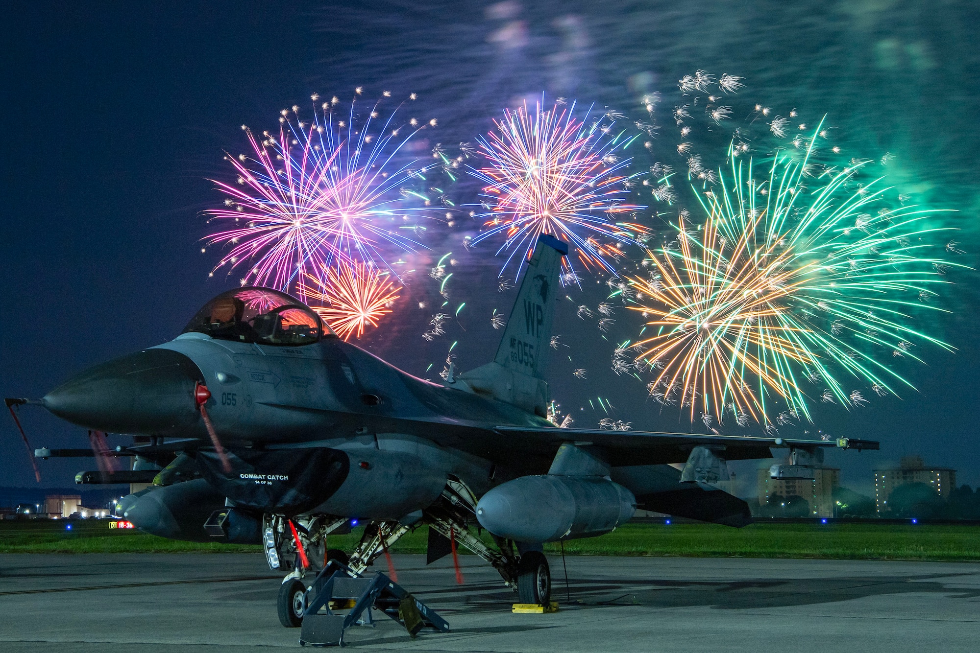 Fireworks behind F-16