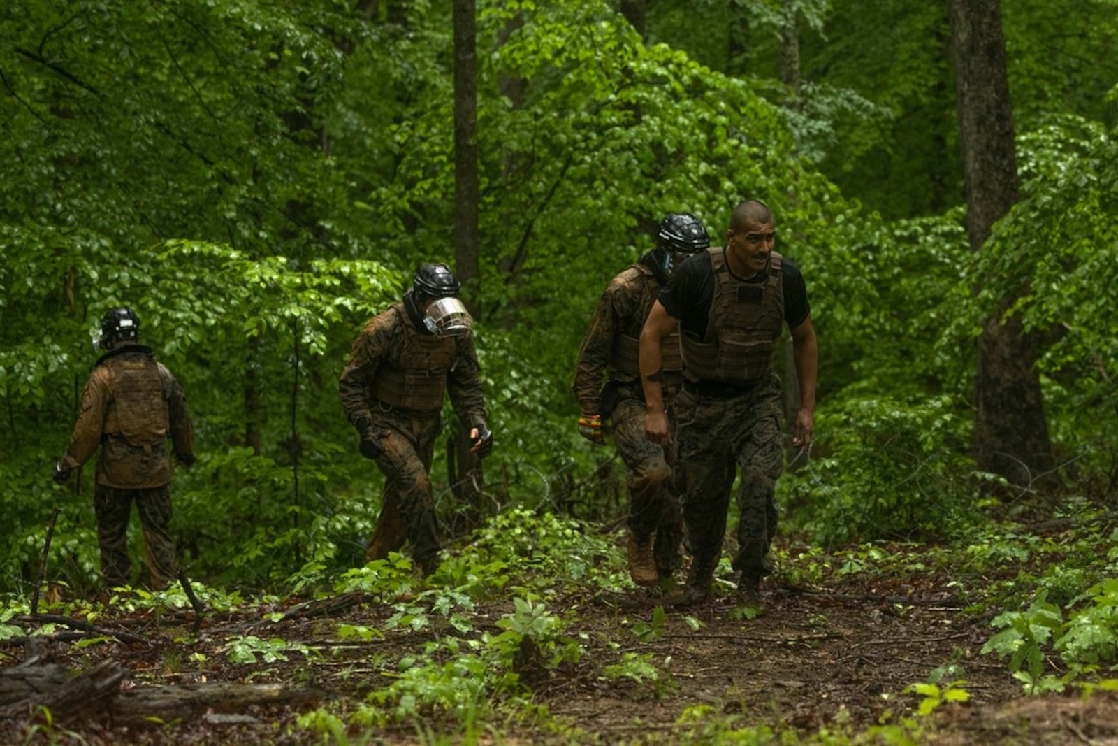 U.S. Marines with the Martial Arts Instructor Trainer Course 2-25, walk to their next engagement during the “Fighting Holes” training event at The Basic School on Marine Corps Base Quantico, May 13, 2025. Squads engaged head-to-head inside of fighting holes simulating close quarter combat while implementing techniques learned within the Marine Corps Martial Arts Program