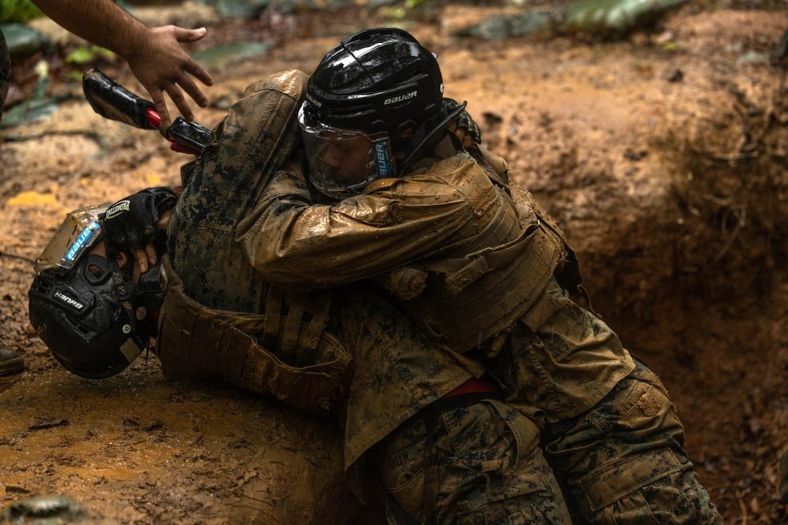 Students with the Martial Arts Instructor Trainer Course 2-25, spar during the “Fighting Holes” training event at The Basic School on Marine Corps Base Quantico, May 13, 2025. Squads engaged head-to-head inside of fighting holes simulating close quarter combat while implementing techniques learned within the Marine Corps Martial Arts Program. (U.S. Marine Corps photo by Lance Cpl. Harleigh Faulk)