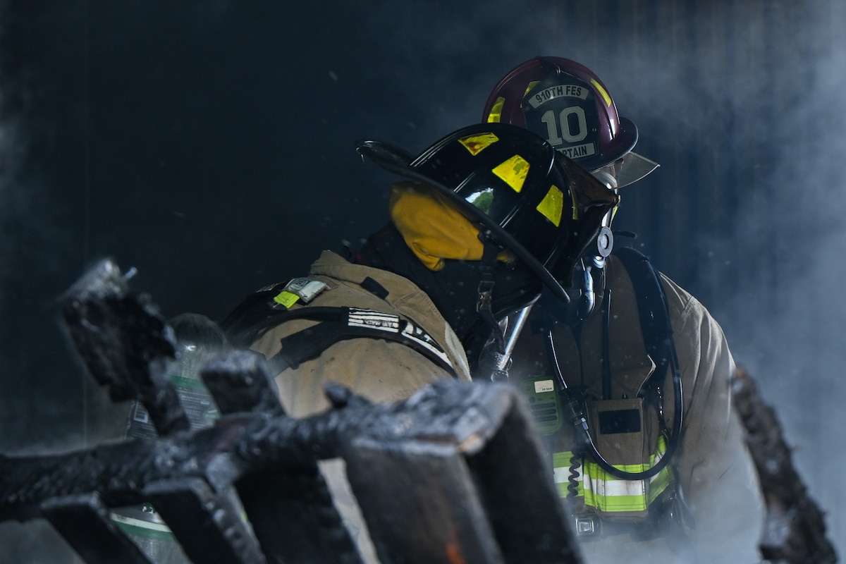 Base firefighters put out the remains of a debris fire during a training exercise at Youngstown Air Reserve Station, Ohio, May 20, 2025.
