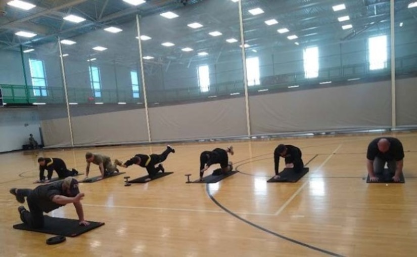 Corey Ioerger leads a core strength class at the Fort Riley SRU.