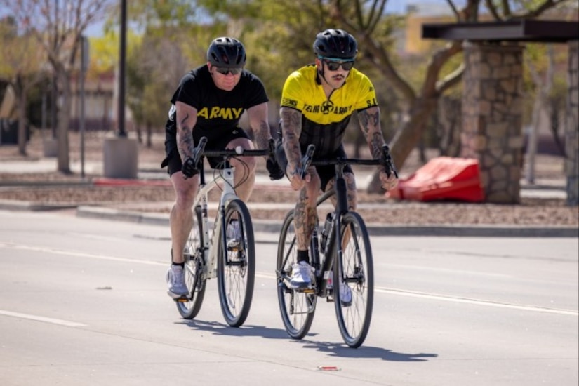 U.S. Army Master Sgt. Kain Proffit , behind, follows Staff Sgt. Taylor Trombley, front, during the men’s road cycling competition at the 2025 Army Trials, Fort Bliss, Texas, April 6, 2025.