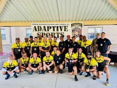 Staff Sgt. Taylor Trombley (Middle left) and his fellow adaptive sports athletes along with Recreational Therapist Robyn Womac (far Right) at the Fort Campbell Soldier Recovery Unit.