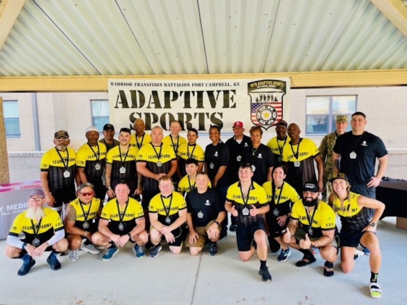 Staff Sgt. Taylor Trombley (Middle left) and his fellow adaptive sports athletes along with Recreational Therapist Robyn Womac (far Right) at the Fort Campbell Soldier Recovery Unit.