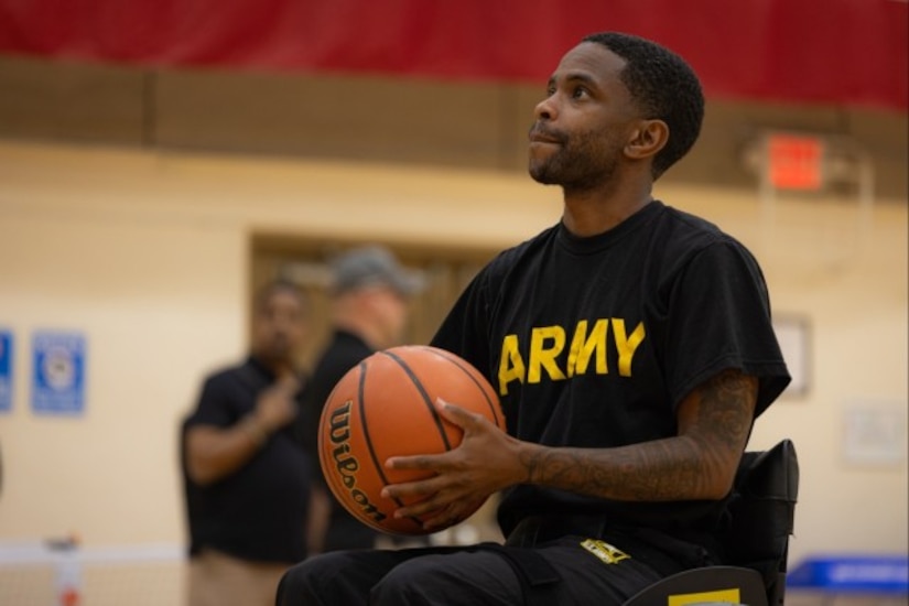 .S. Army Staff Sgt. Allaijah Churchwell sets up to the shoot the ball during wheelchair basketball practice at the 2025 Army Trials, Fort Bliss, Texas, April 2, 2025.
