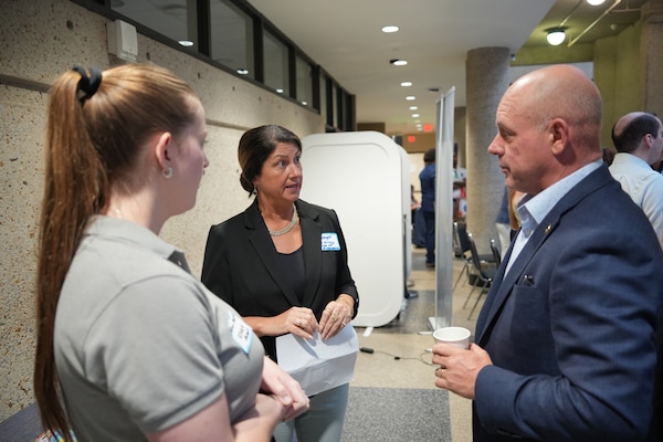 Bridget Passatore (center), contract officer for the U.S. Army Corps of Engineers Nashville District, talks with a small business owner about contract opportunities during the BIZGOV Connect event at Tennessee State University on May 20, 2025, in Nashville, Tenn., as Alison Abernathy (left), also a contracting officer with the district, listens. (U.S. Army Corps of Engineers photo by Noe Gonzalez)
