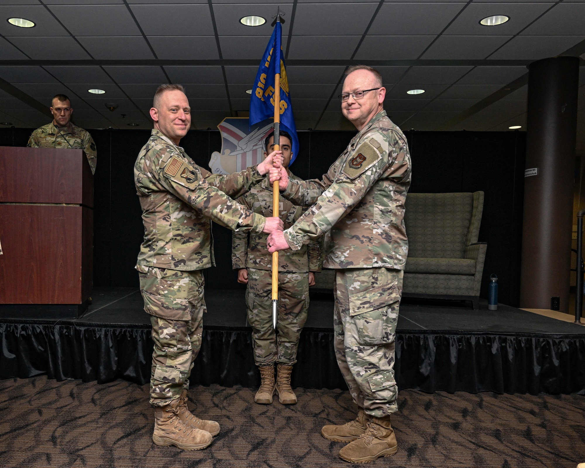 Lt. Col. Russell R. Whitlock (right), 910th Force Support Squadron commander, receives the guidon from Lt. Col. Benjamin J. Iannucci (left), 910th Mission Support Group commander, during his assumption of command ceremony at Youngstown Air Reserve Station, Ohio, May 3, 2025.