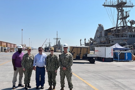 U.S. NAVAL SUPPORT ACTIVITY BAHRAIN – Rear Adm. Dianna Wolfson, U.S. Fleet Forces Command (USFFC) fleet maintenance officer, and Eric Lind, Commander, Navy Regional Maintenance Center (CNRMC) executive director, Capt. Mollie Bily, Forward Deployed Regional Maintenance Center (FDRMC) commanding officer, Cmdr. Micah Munden, FDRMC Detachment Bahrain officer in charge, and Paul Crawford, FDRMC Detachment Bahrain LCS class team lead, tour pier facilities with four Avenger-class mine countermeasure ships in port.