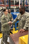 U.S. NAVAL SUPPORT ACTIVITY BAHRAIN – Rear Adm. Dianna Wolfson, U.S. Fleet Forces Command (USFFC) fleet maintenance officer, discuss intermediate-level maintenance capabilities with Forward Deployed Regional Maintenance Center Detachment Bahrain Repair Officer Chief Warrant Officer 4 Earl Stagg III.