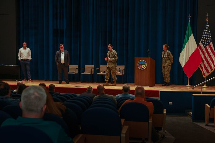 U.S. NAVAL SUPPORT ACTIVITY NAPLES, Italy – Rear Adm. Dianna Wolfson, U.S. Fleet Forces Command (USFFC) fleet maintenance officer, and Eric Lind, Commander, Navy Regional Maintenance Center (CNRMC) executive director, conduct an all-hands call with Forward Deployed Regional Maintenance Center personnel.