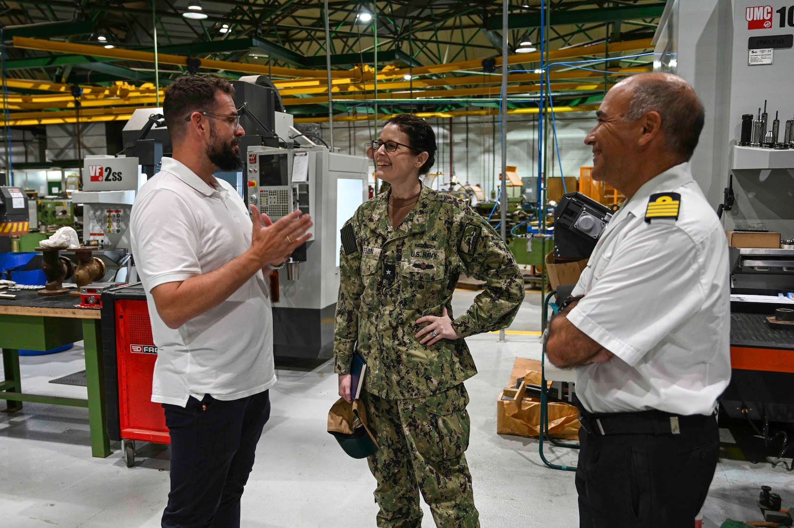 NAVAL STATION ROTA, Spain – Rear Adm. Dianna Wolfson, U.S. Fleet Forces Command (USFFC) fleet maintenance officer discusses JEMANDIZ, the Spanish Armada Intermediate-Level maintenance facility, capabilities alongside Spanish Armada Captain Juan Jose Nieto and Forward Deployed Regional Maintenance Center and Spanish Armada personnel.