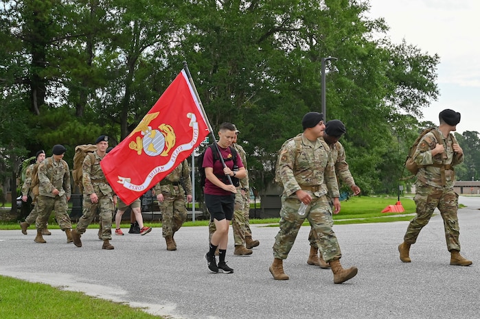 Participants take part in a 628th Security Forces Squadron Police Week ruck march.