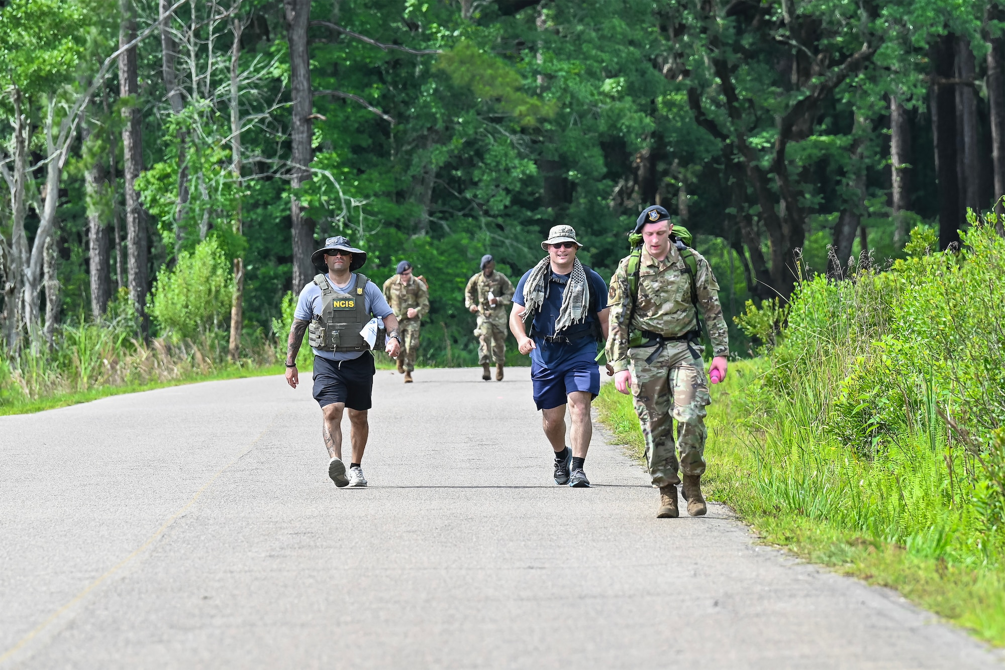 Service members walking down the road during the Police Week ruck march.