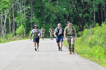 Service members walking down the road during the Police Week ruck march.