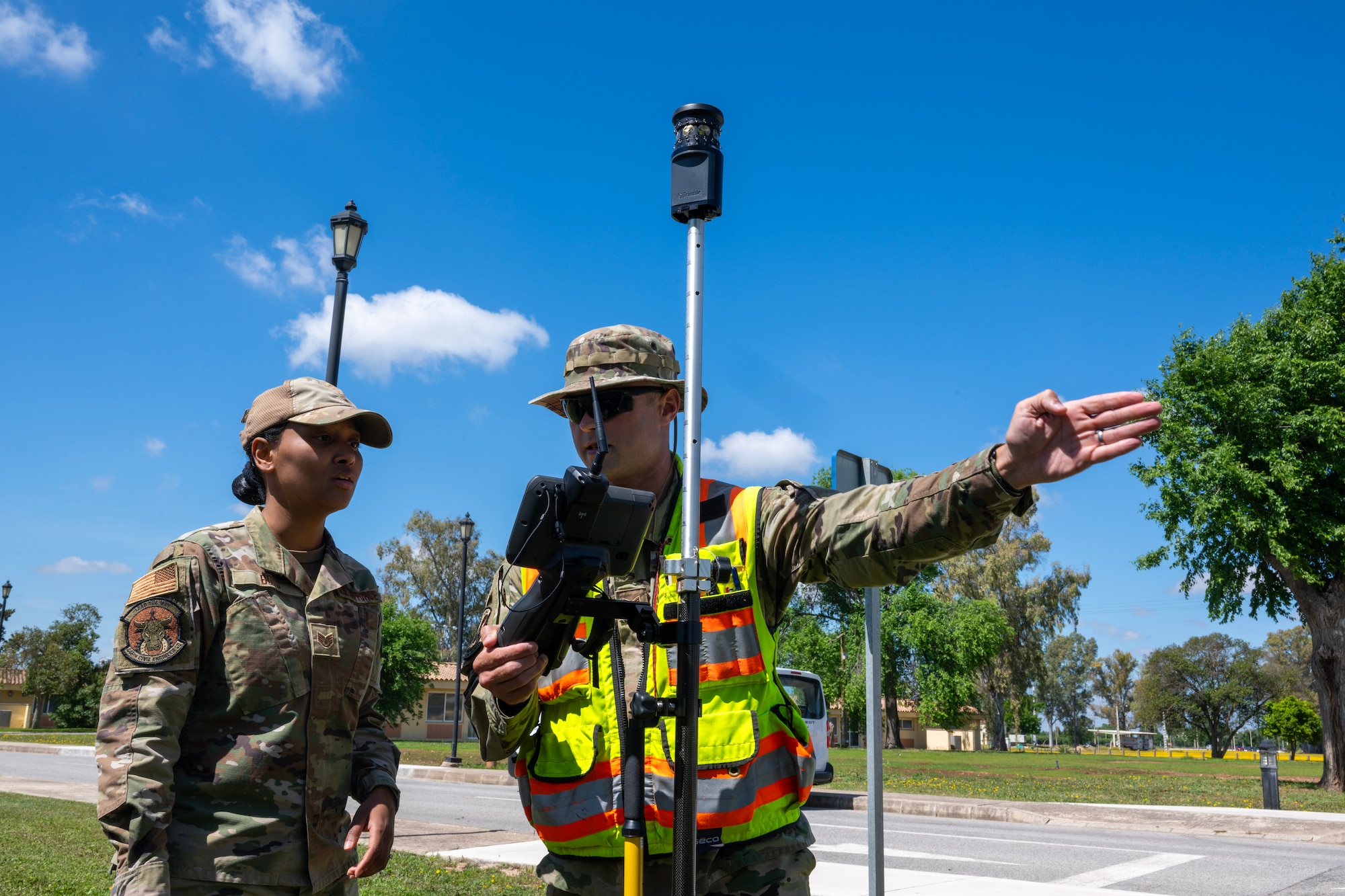 Staff Sgt. Michael Chiniquy, 446th Civil Engineer Squadron engineering assistant, teaches Staff Sgt. Jamie Boyd, 446th CES pest management, how to plot points for a ground survey at Moron Air Base, Spain, on May 6, 2025.