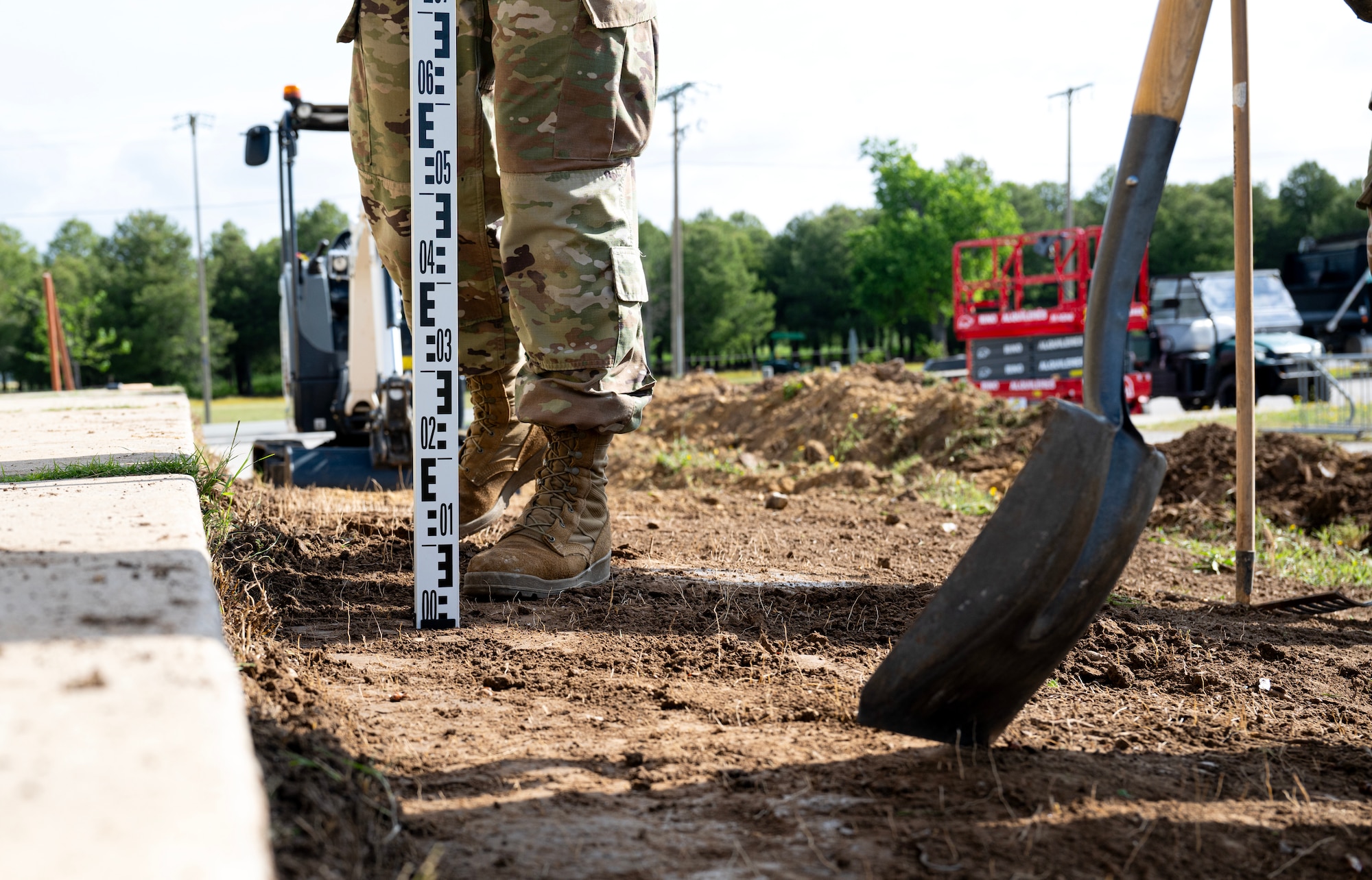 446th Civil Engineer Squadron pavement and construction equipment Airmen check the level of the ground at Moron Air Base, Spain, on May 6, 2025.
