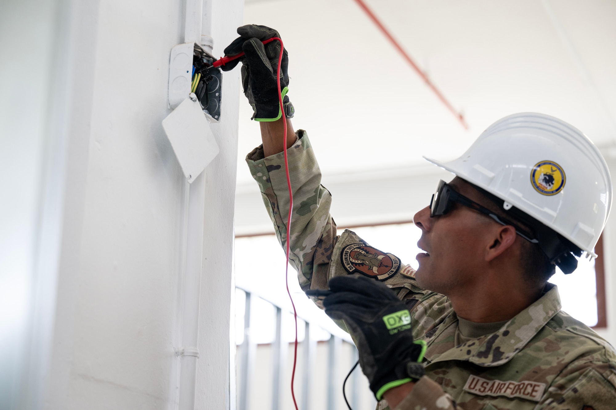 Senior Airman Alvarado Orellana, 446th Civil Engineer Squadron electrical systems assistant, inspects wiring at Moron Air Base, Spain, on May 6, 2025.